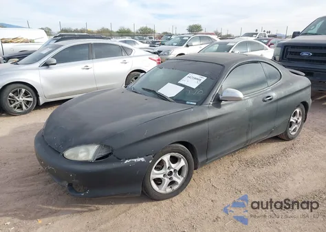 1999 Hyundai Tiburon Fx z USA, uszkodzony, nr VIN KMHJG34F6XU135627